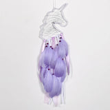 Atrapasueños unicornio plumas púrpuras